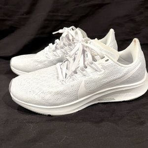 All white Nike womens running shoe